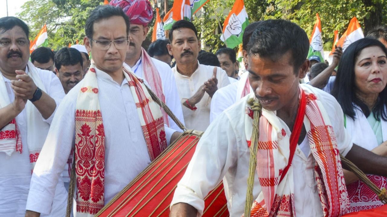 Congress MP Gaurav Gogoi plays drum as he participates in the party's 'Bharat Jodo Yatra-Assam', in Guwahati, Thursday, Nov. 17, 2022. Credit: PTI Photo