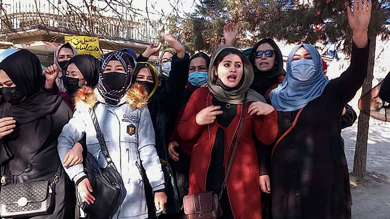 Afghan women chant slogans to protest against the ban on university education for women, in Kabul. Credit: AFP Photo