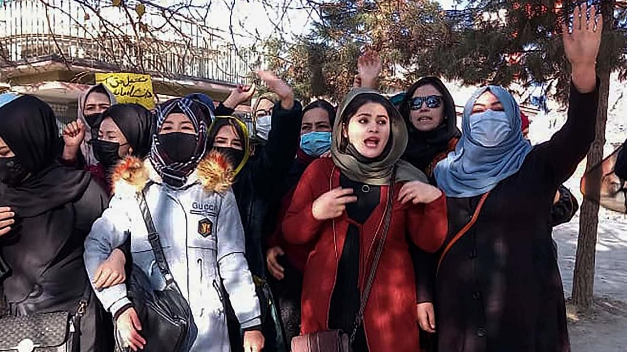 Afghan women chant slogans to protest against the ban on university education for women, in Kabul. Credit: AFP 