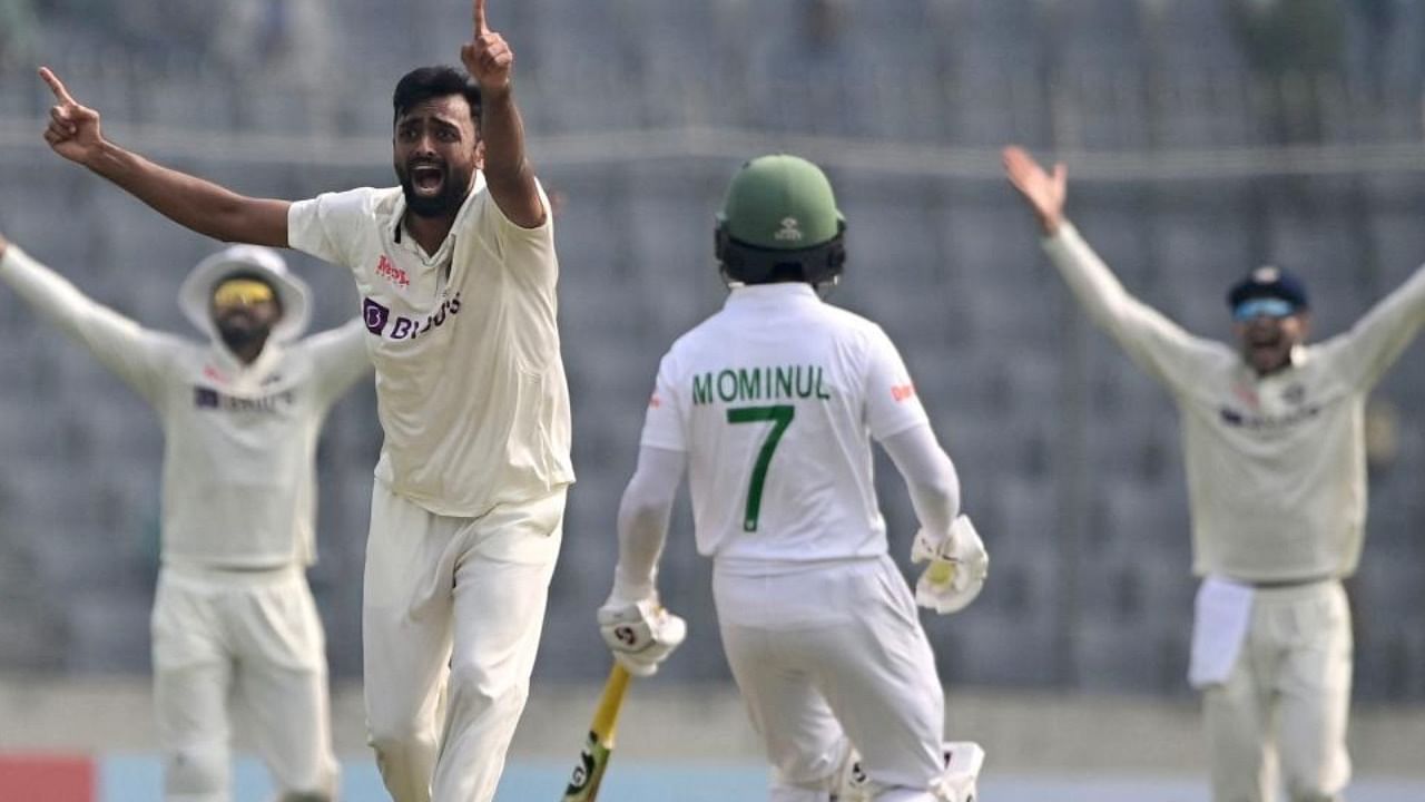 Jaydev Unadkat (2nd L) appeals unsuccessfully for a leg before wicket decision against Bangladesh's Mushfiqur Rahim during the first day of the second cricket Test match between Bangladesh and India at the Sher-e-Bangla National Cricket Stadium in Dhaka on December 22, 2022. Credit: AFP Photo