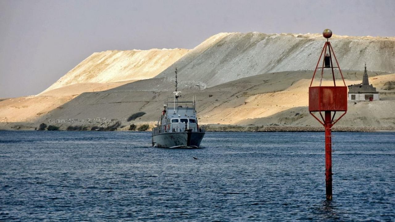 In this file photo taken on March 30, 2021 An Egyptian navy craft patrols as ships resume navigation in the Suez Canal. Credit: AFP Photo