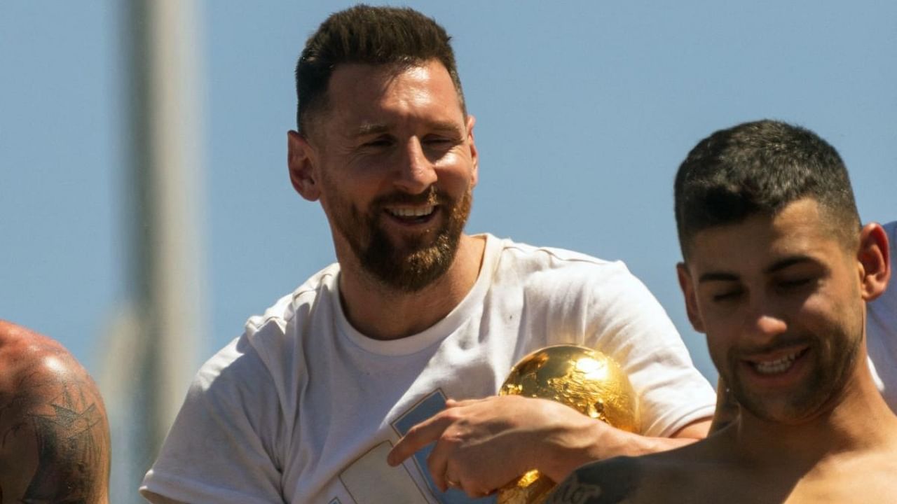 Messi with the World Cup during the team's victory parade in Argentina. Credit: AFP Photo