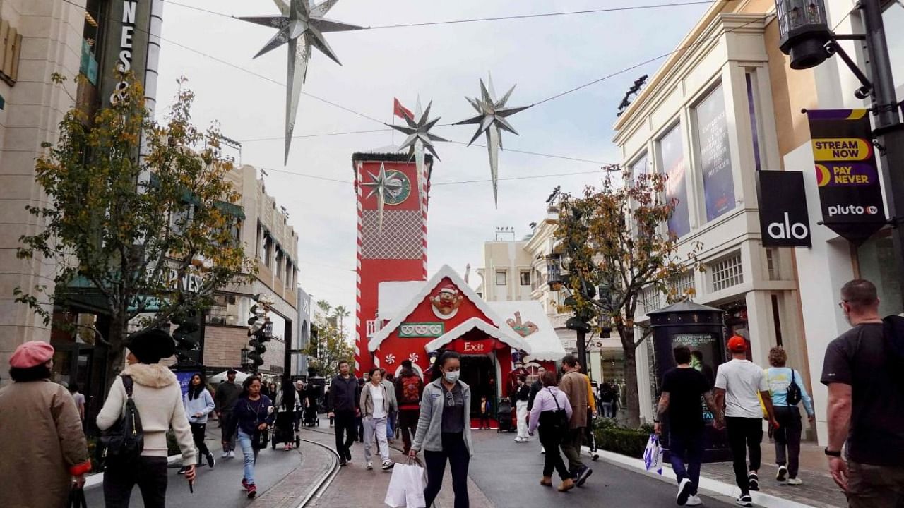 Shoppers walk through The Grove shopping mall during the holiday shopping season, three days before Christmas. Credit: AFP Photo/Getty