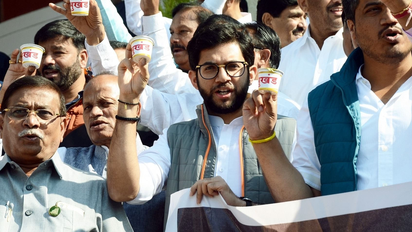 Shiv Sena (Uddhav Thackeray), Congress and NCP MLAs take part in a demonstration against Maharashtra government outside the Vidhan Bhavan during the winter session of the state, in Nagpur. Credit: IANS Photo