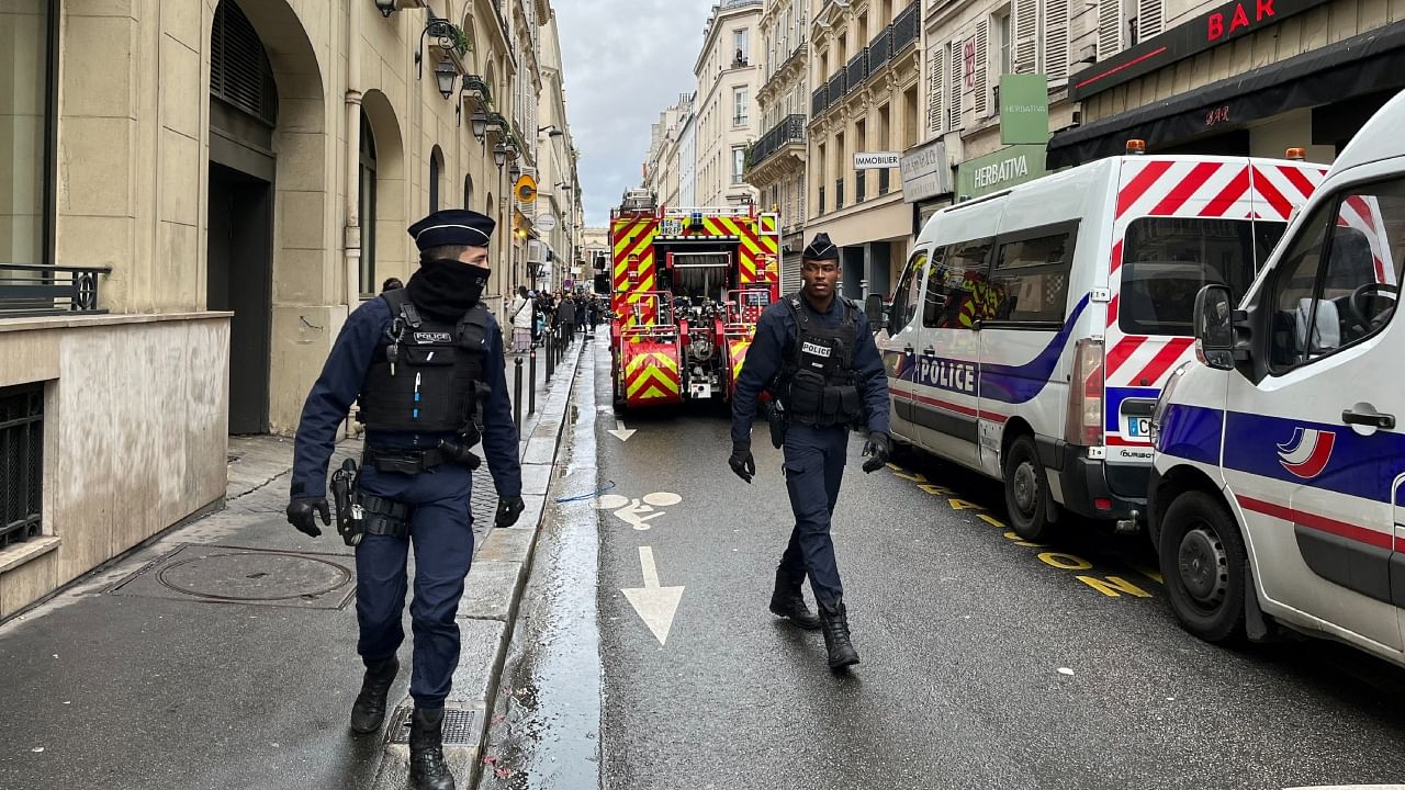 French police and firefighters secure a street after gunshots were fired killing two people and injuring several in a central district of Paris, France, December 23, 2022. Credit: Reuters Photo