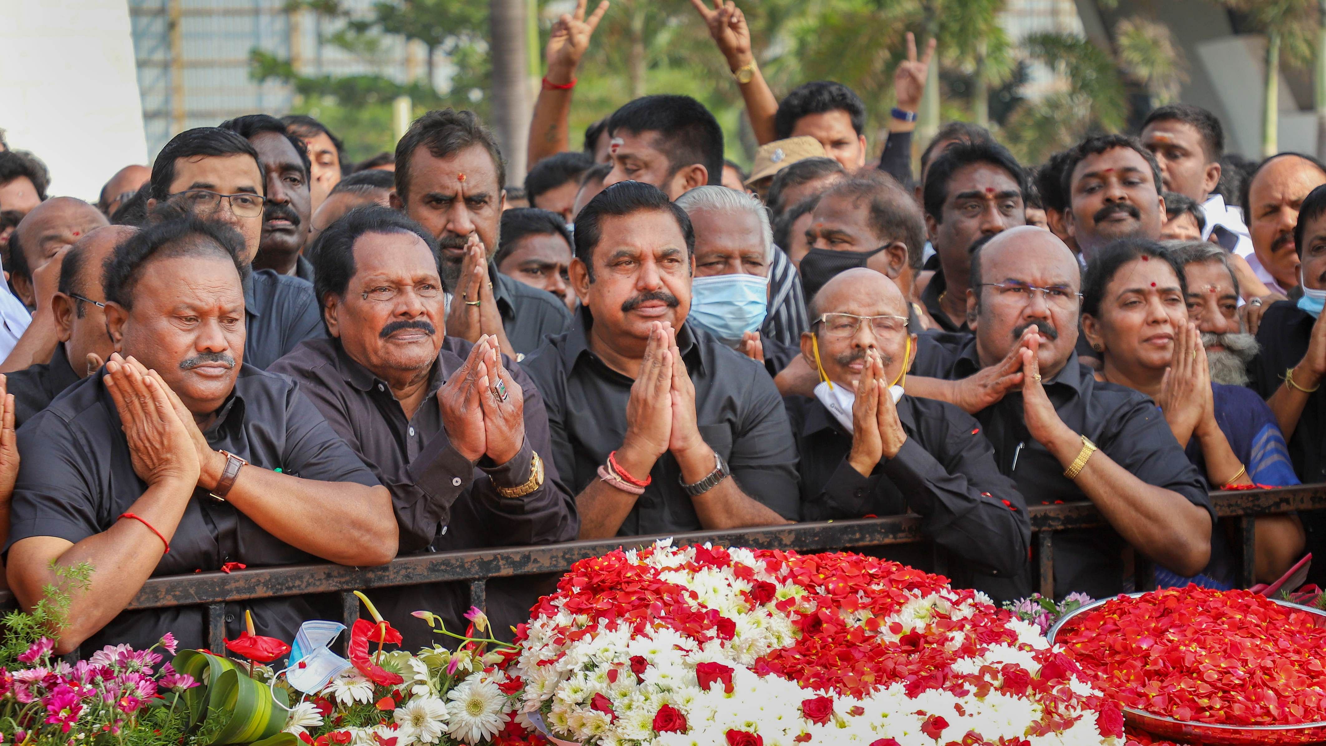  AIADMK leader Edappadi K Palaniswami with party leaders and supporters pays floral tributes to former chief minister and party founder MG Ramachandran on his death anniversary. Credit: PTI Photo