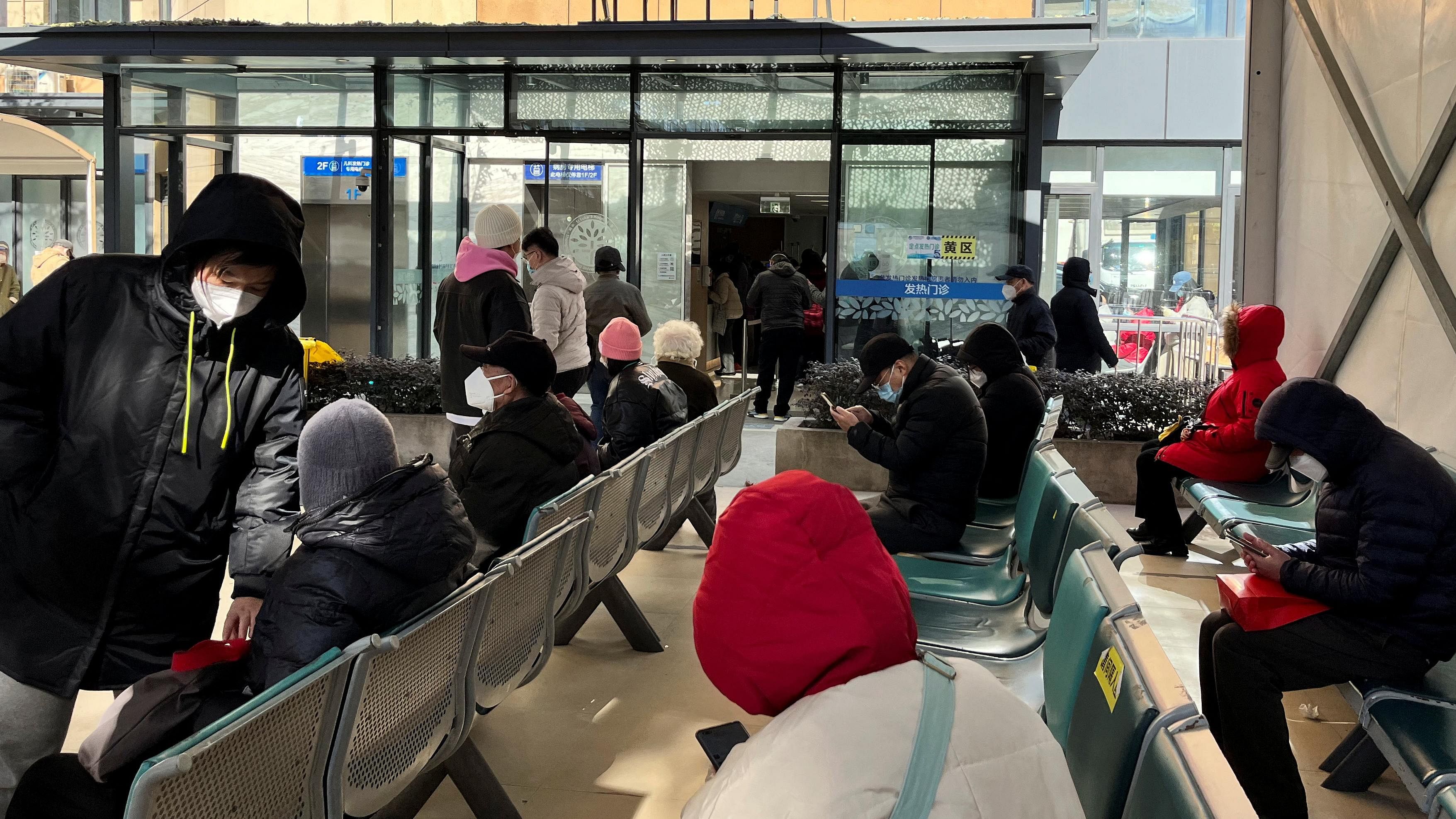 People wait outside a fever clinic at a hospital as coronavirus disease (Covid-19) outbreak continues, in Shanghai, China December 24. Credit: Reuters Photo