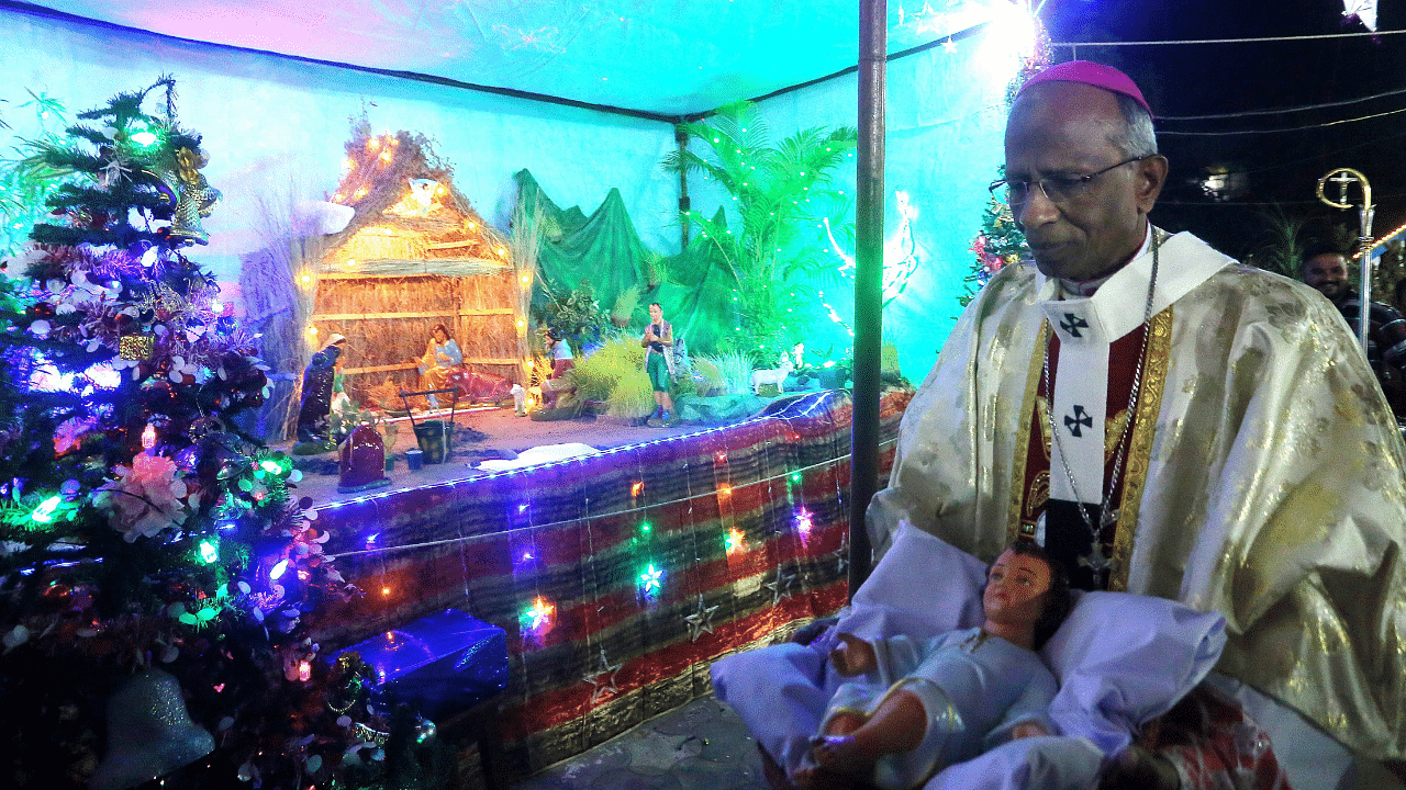 Archbishop AAS Durairaj during the midnight mass on the occasion of Christmas festival at St Francis Assisi Cathedral, in Bhopal. Credit: PTI Photo