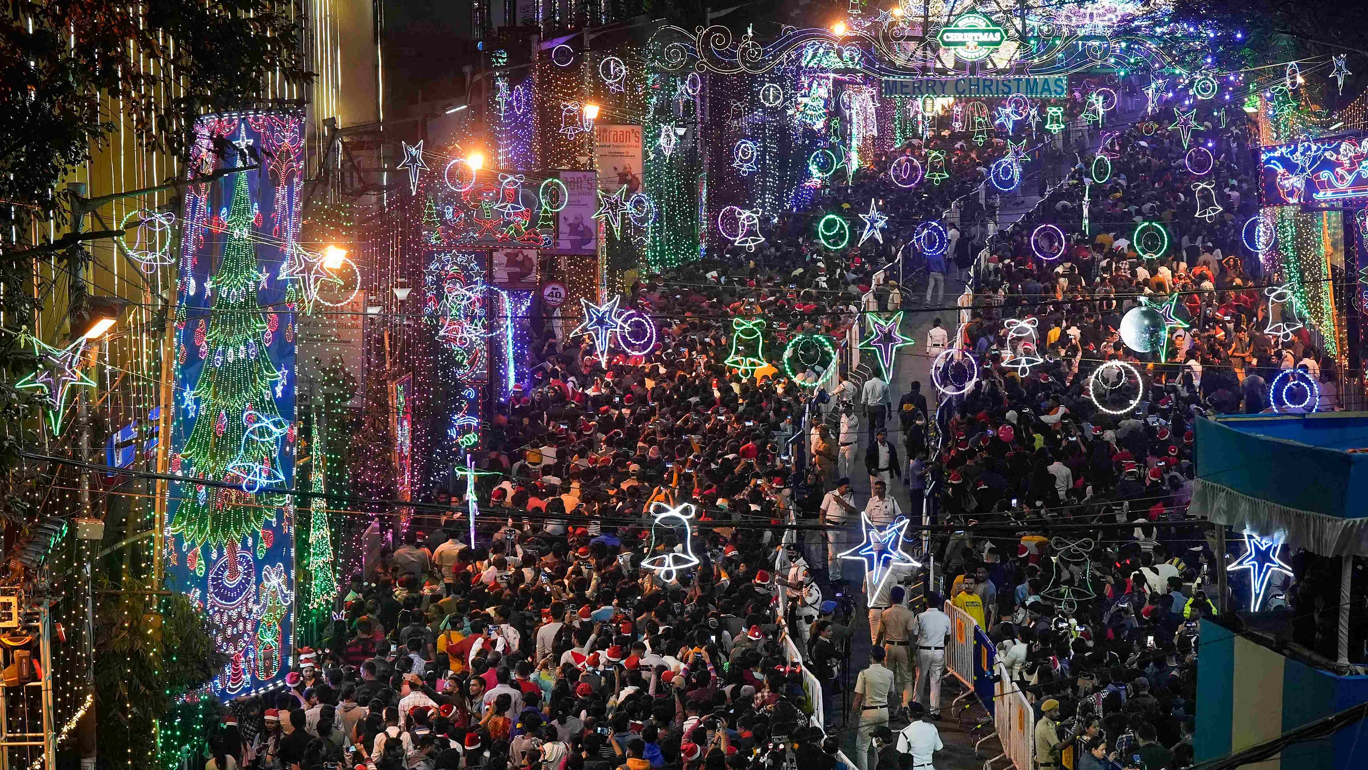 People in large numbers gather at Park Street to celebrate Christmas. Credit: PTI Photo