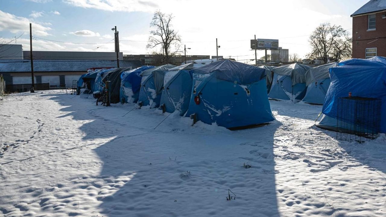 Deep snow, single-digit temperatures and day-old power outages sent Buffalo residents scrambling Saturday to get out of their houses to anywhere that had heat. Credit: Getty Images/AFP Photo