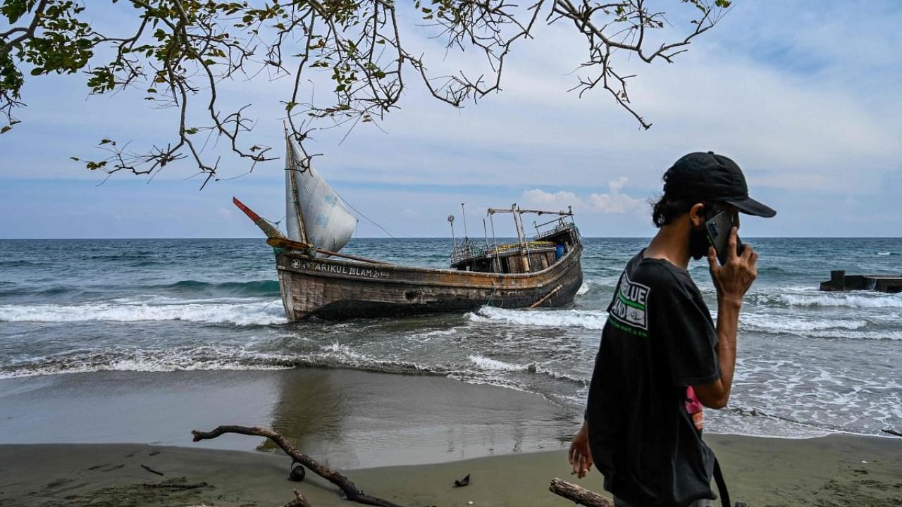 This picture shows a boat that was carrying Rohingya refugees after their arrival at a beach in Krueng Raya, Indonesia's Aceh province. Credit: AFP Photo