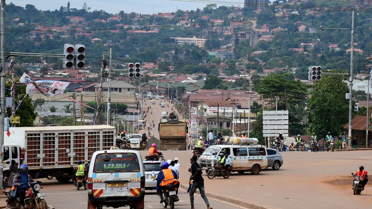 Motorists and cyclists are seen at a traffic light intersection amid the Ebola outbreak in Kampala, Uganda. Credit: Reuters File Photo
