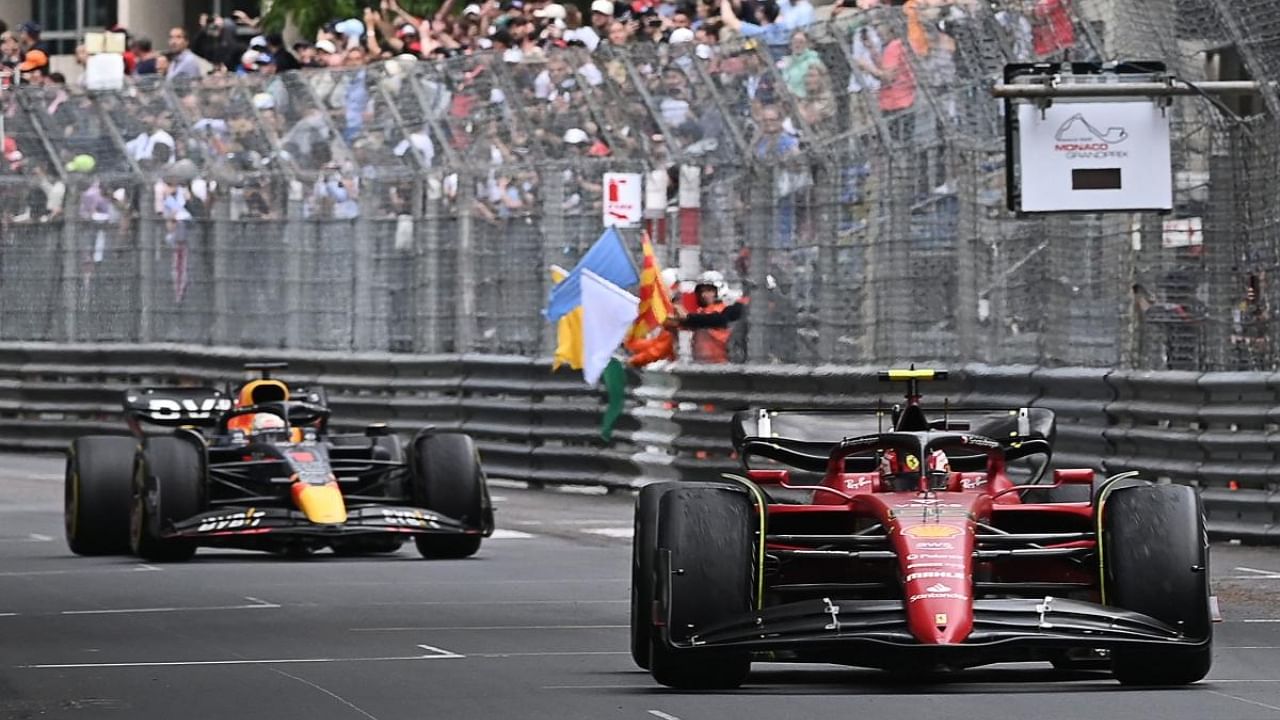 Second-placed Ferrari's Spanish driver Carlos Sainz Jr (R) and third-placed Red Bull Racing's Dutch driver Max Verstappen drive a last lap after the Monaco Formula 1 Grand Prix. Credit: AFP Photo