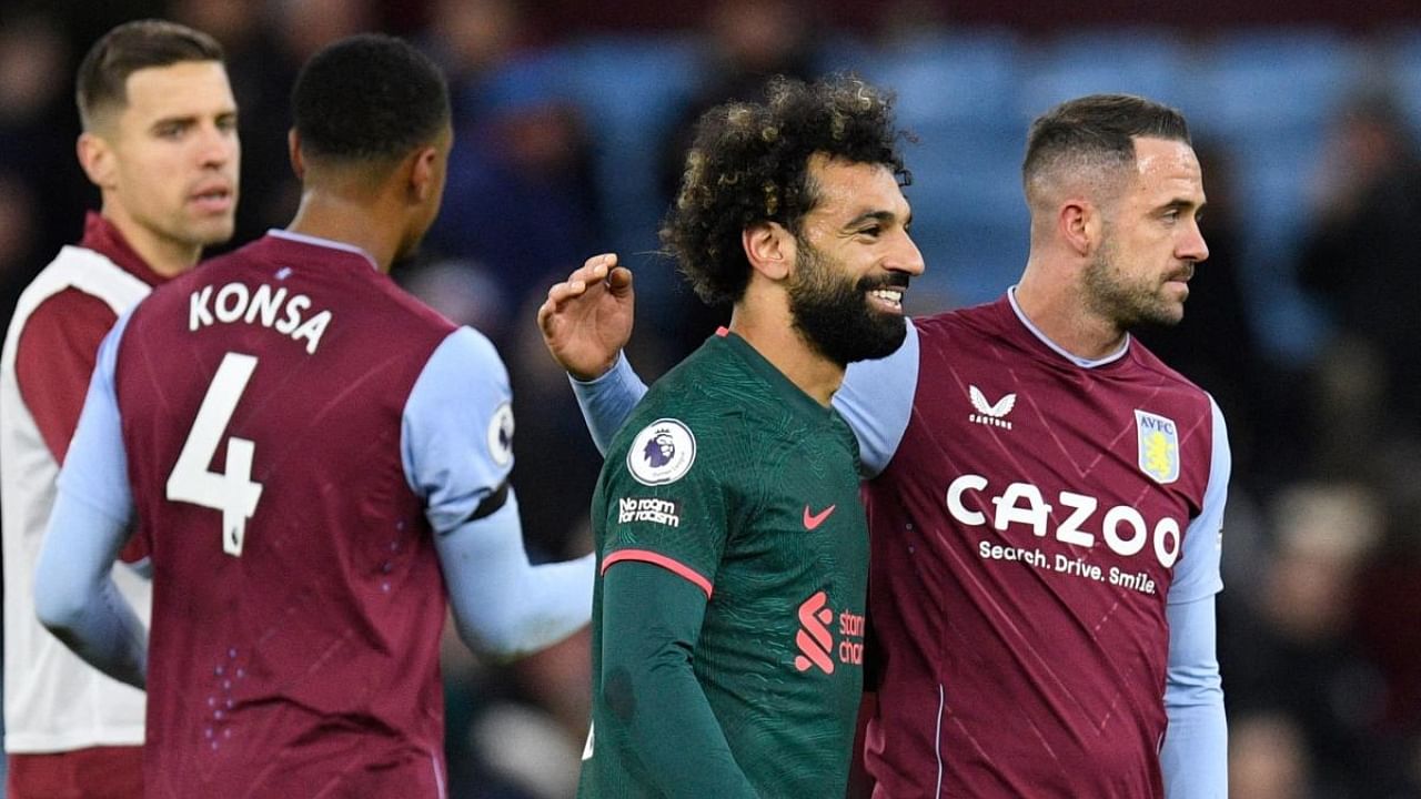 Liverpool's Egyptian striker Mohamed Salah (2nd R) congratulates Aston Villa's English striker Danny Ings (R) at the end of the English Premier League football match between Aston Villa and Liverpool at Villa Park in Birmingham, central England on December 26, 2022. Credit: AFP Photo