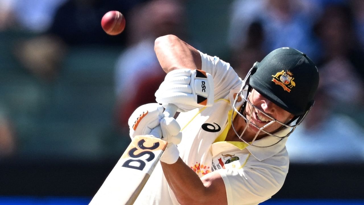 Australian batsman David Warner plays a shot on the second day of the second cricket Test match between Australia and South Africa at the MCG in Melbourne on December 27, 2022. Credit: AFP Photo