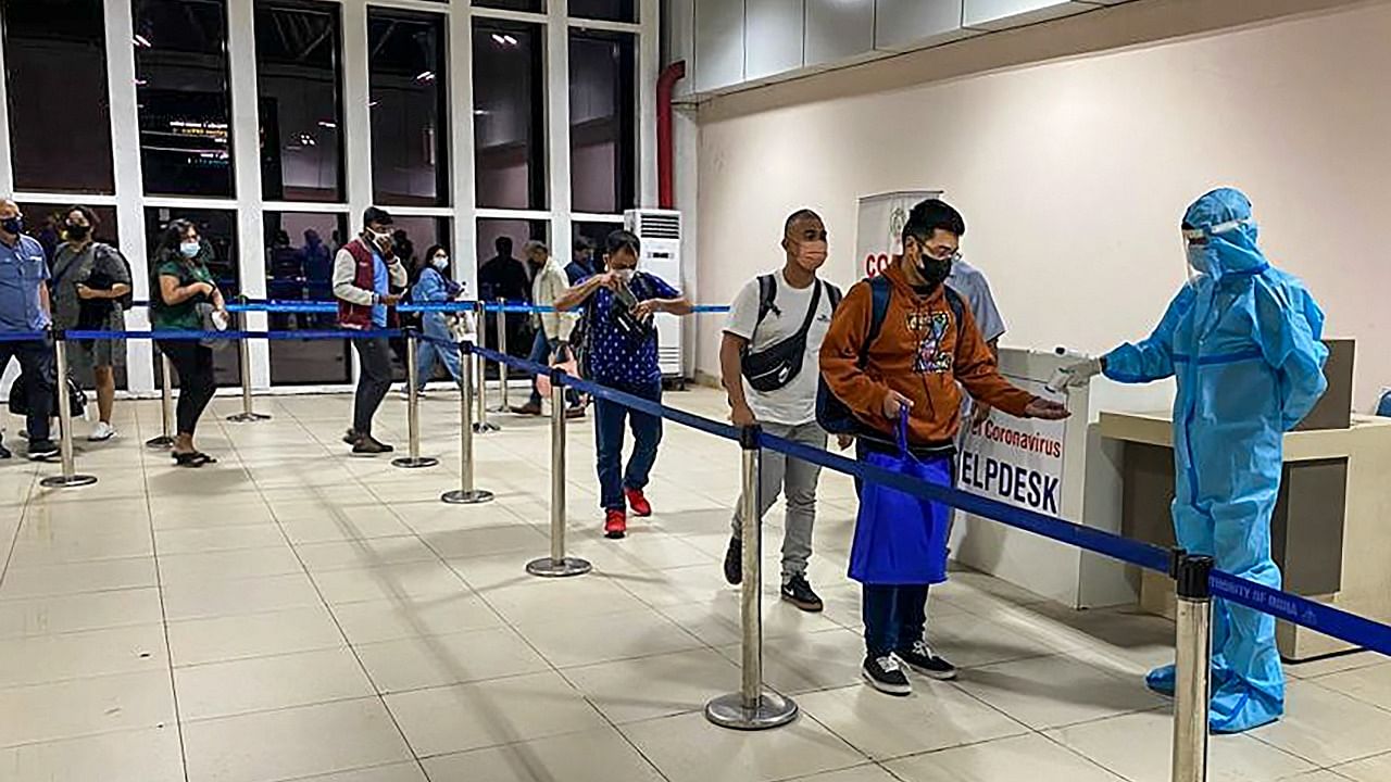 Passengers undergo thermal screening as random Covid-19 testing starts at various airports across the country in the wake of rising cases of Coronavirus globally. Credit: PTI Photo