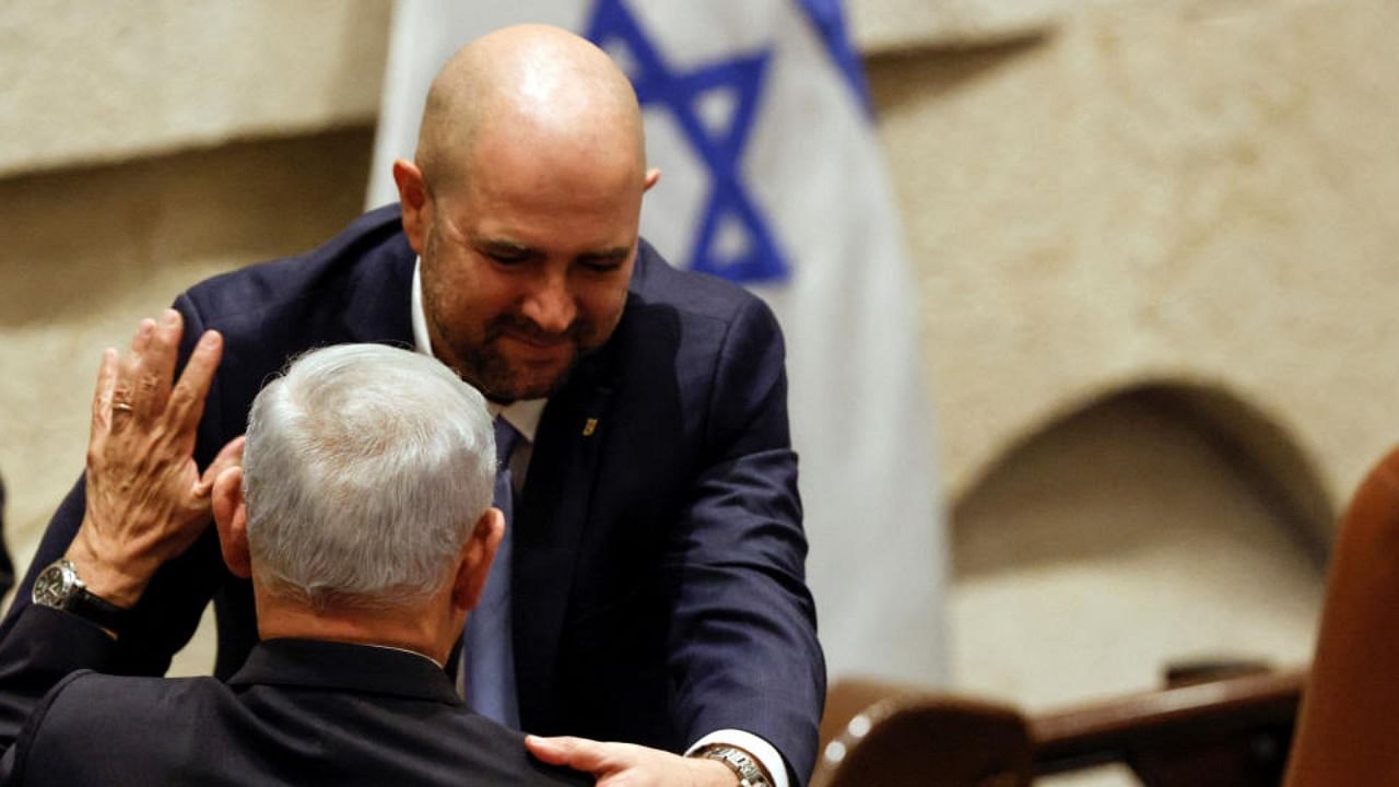 The new Speaker of the knesset Amir Ohana congratulates Israeli Prime Minister Benjamin Netanyahu as Israel's new right-wing government is sworn in at the Knesset, Israel's parliament in Jerusalem December 29, 2022. Credit: Reuters Photo