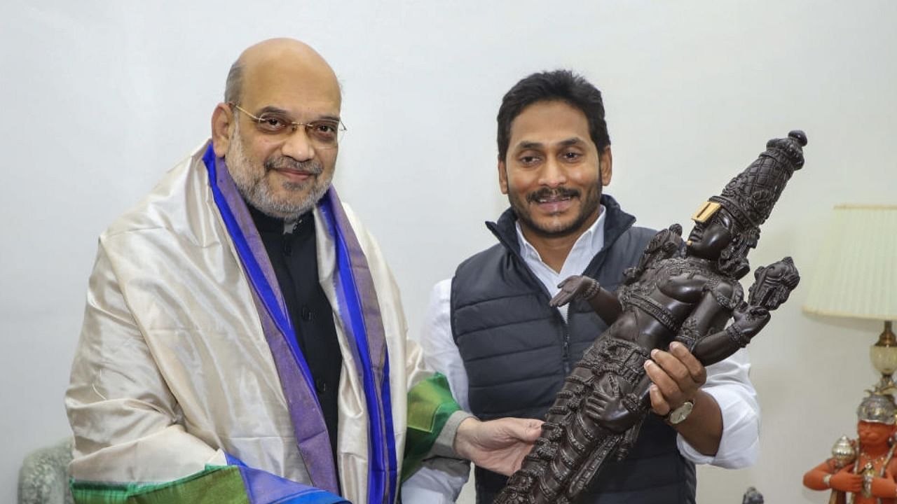 Andhra Pradesh Chief Minister YS Jagan Mohan Reddy presents a memento to Union Home Minister Amit Shah, in New Delhi, Thursday, Dec. 29, 2022. Credit: PTI Photo