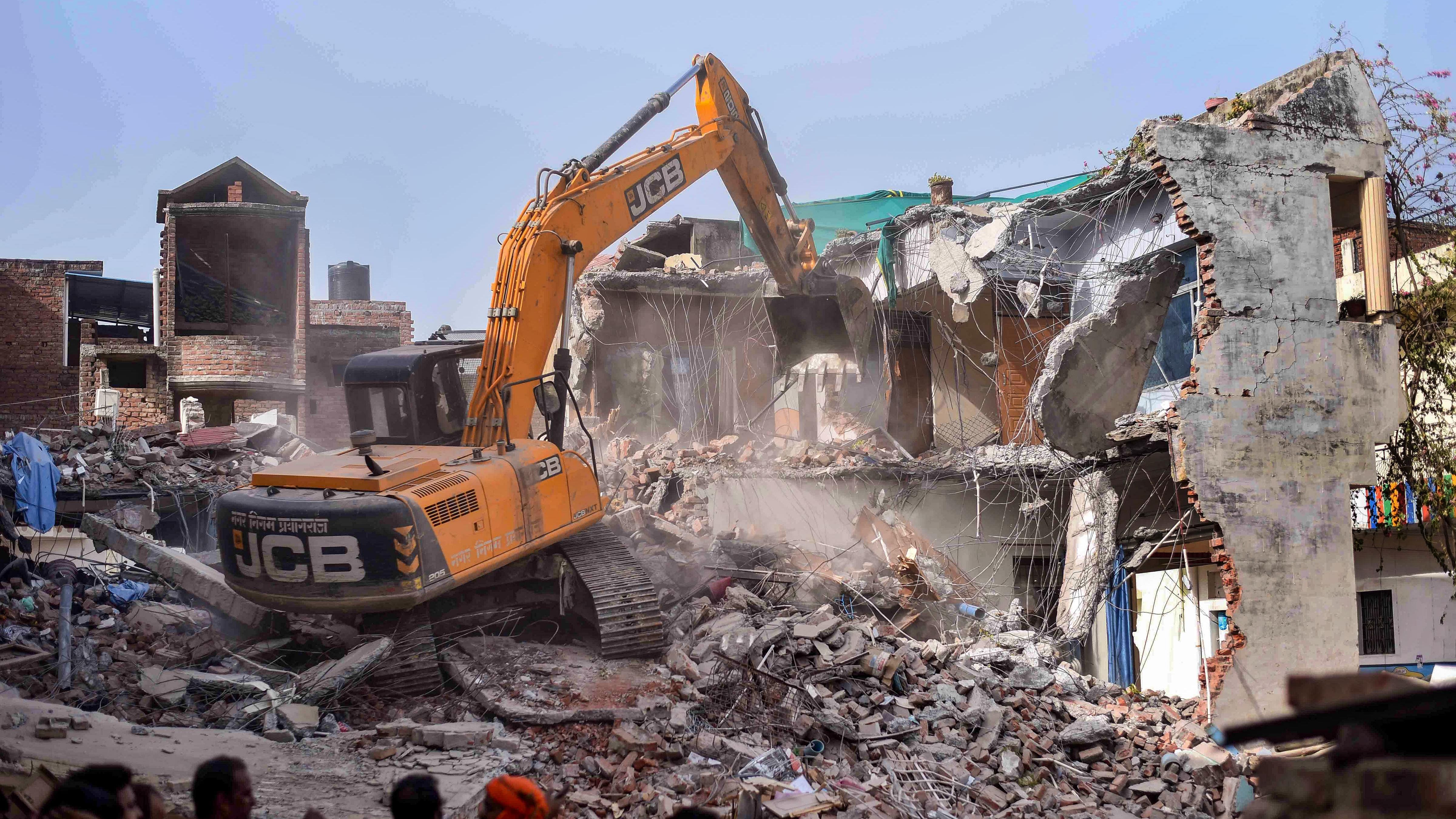 Adityanath’s second term saw bulldozers demolishing properties of alleged criminals and people involved in riots, earning the CM the sobriquet of “Baba Bulldozer”. Credit: PTI Photo
