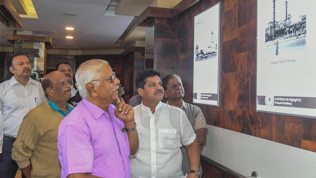 Wildlife photographer Thippeswamy S at the exhibition. Credit: Special Arrangement