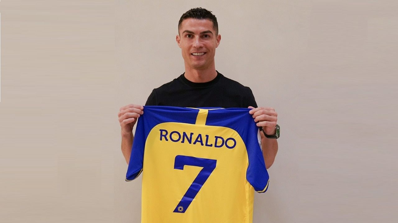 Ronaldo was pictured on the Al Nassr Twitter feed holding a blue and yellow shirt with his favoured number seven printed on the back. Credit: Twitter/@AlNassrFC_EN