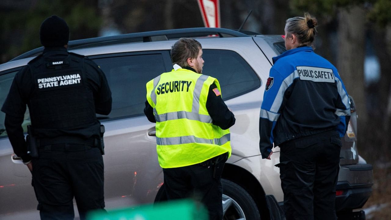 Security workers and Pennsylvania State Agents stand guard at the gate of the private Indian Mountain Lake community after Pennsylvania State Police took into custody Bryan Kohberger, a 28-year-old suspect wanted in the killings of four University of Idaho students, in Albrightsville, Pennsylvania, U.S., December 30, 2022. Credit: Reuters Photo