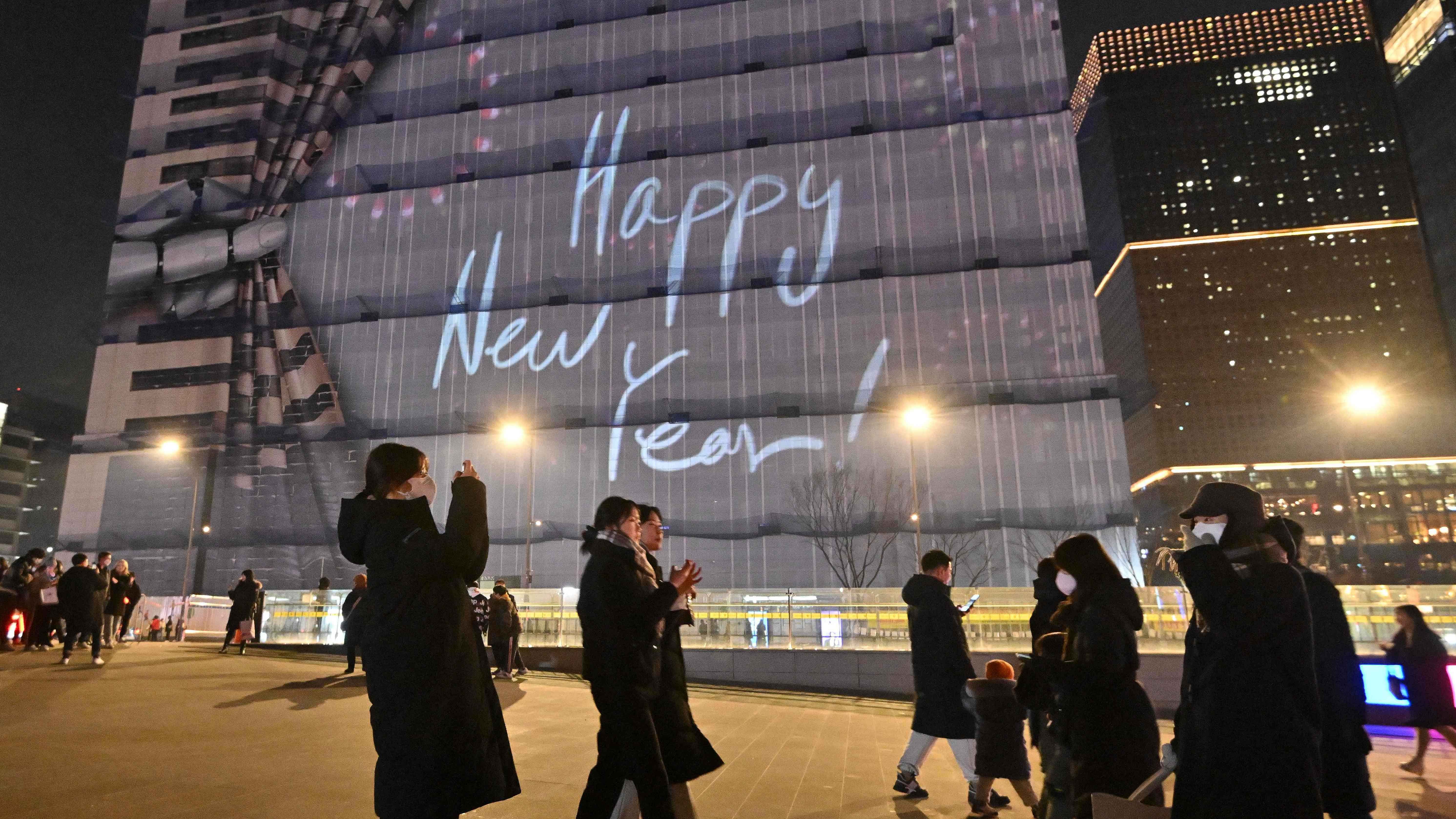 People enjoy the last day of the year on New Year's Eve at Gwanghwamun square in central Seoul on December 31. Credit: AFP Photo