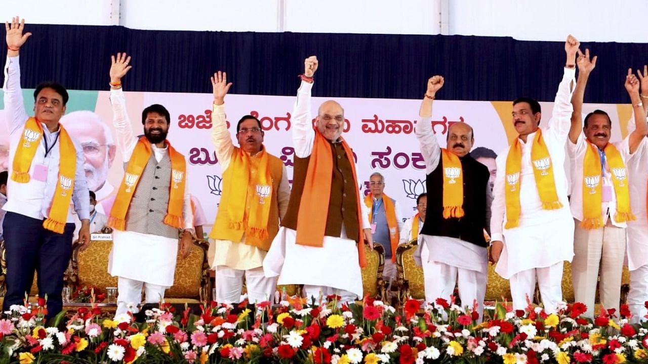 Amit Shah with Karnataka CM Basavaraj Bommai and others during BJP's Booth Sammelan. Credit: PTI Photo