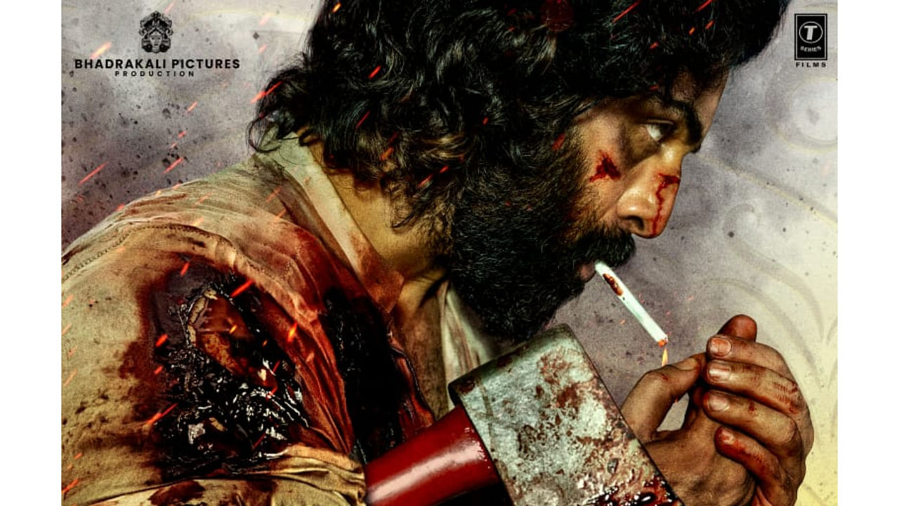 The actor is seen in a rugged avatar, holding an axe and lighting a cigarette. Credit: Twitter/ @imvangasandeep