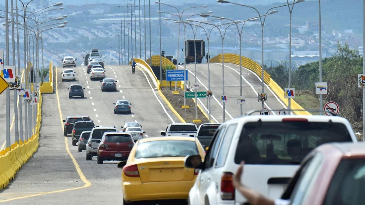 Vehicles cross the Atanasio Girardot International Bridge -formerly known as Tienditas bridge- from Urena, Venezuela, into in Cucuta, Colombia, after the two countries officially reopened their shared land border. Credit: AFP Photo