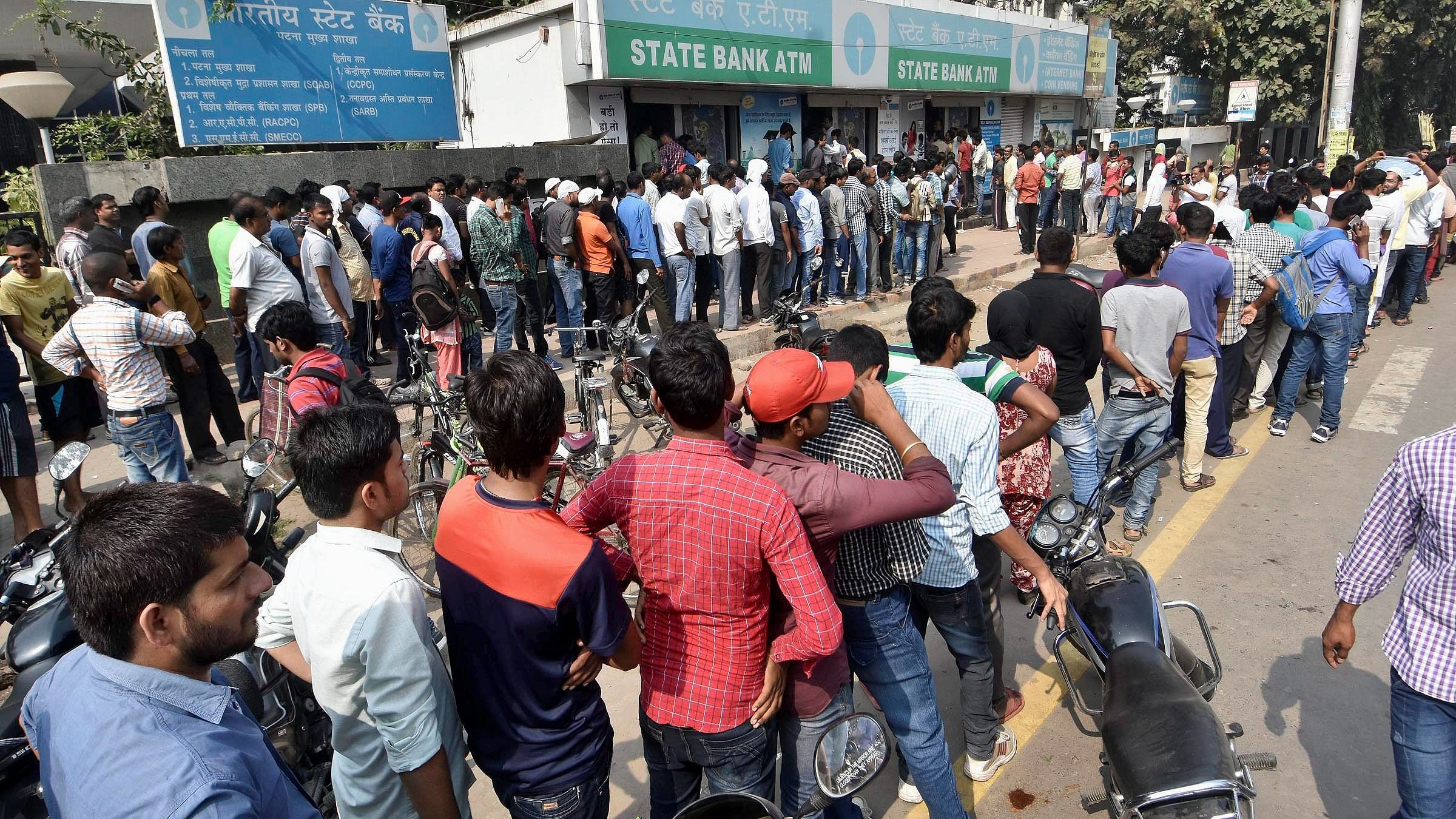 People queue up at an ATM in Patna on Nov. 12, 2016. Credit: PTI File Photo