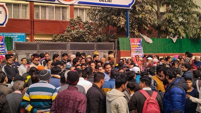 People gathered outside the Sultanpuri police station demanding stern punishment for men accused in Sultanpuri road accident. Credit: PTI Photo