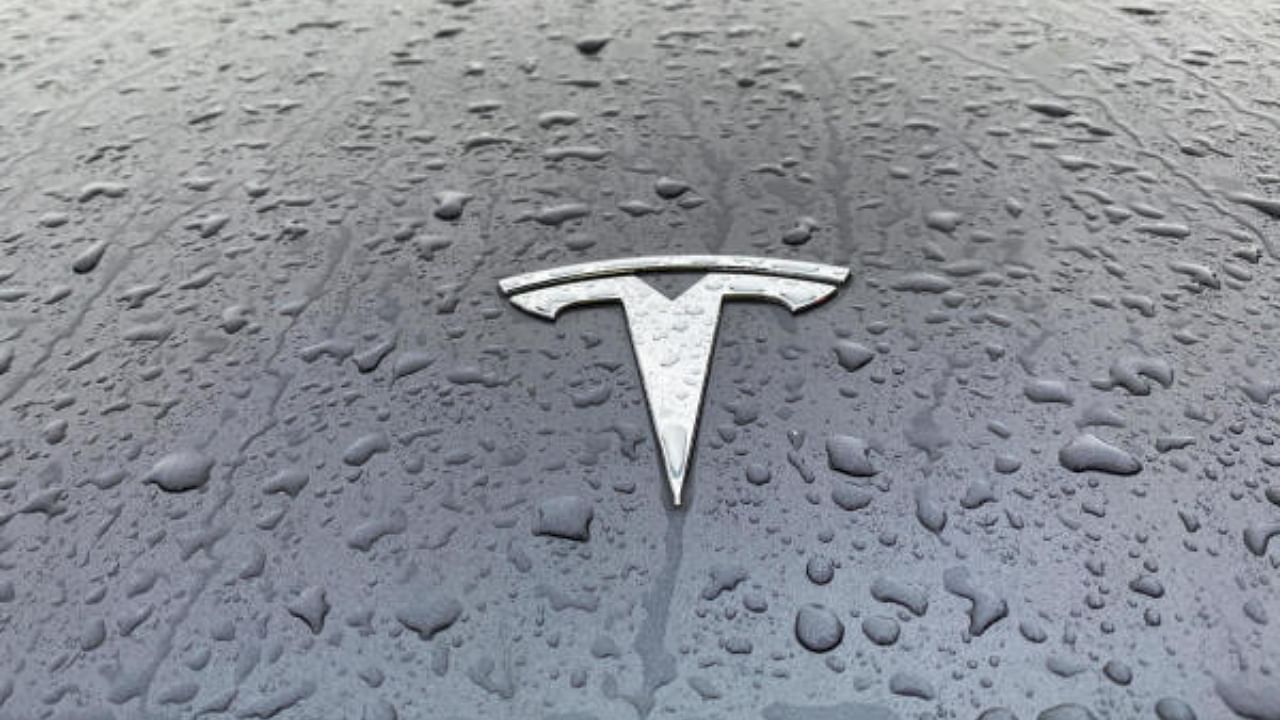 A view shows the Tesla logo on the hood of a car. Credit: Reuters File Photo