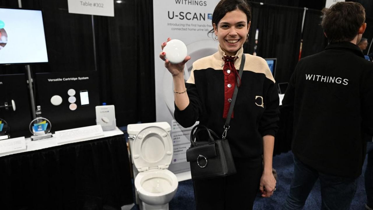 A Withings representative displays the U-Scan, during CES Unveiled ahead of the Consumer Electronics Show (CES). Credit: AFP Photo