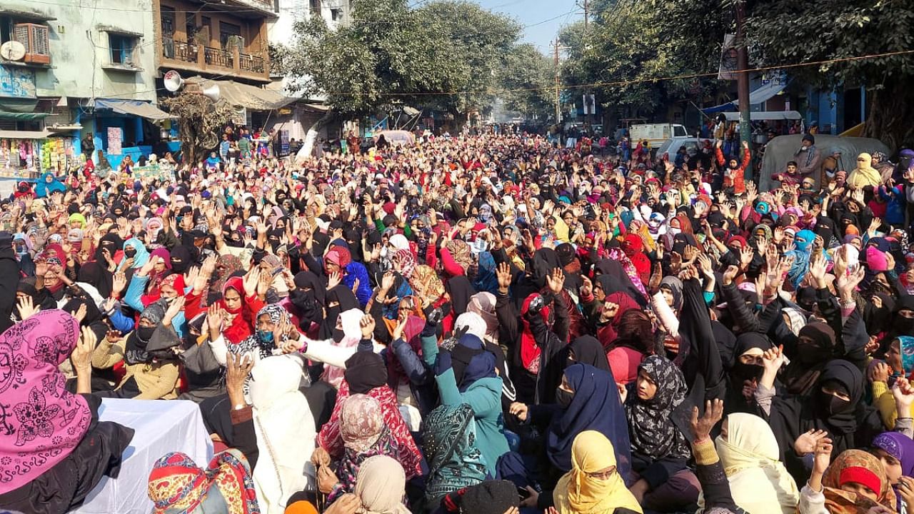 Residents of Banbhoolpura in stage a dharna ahead of the Supreme Court order on the plea opposing their imminent eviction, in Haldwani, Thursday, Jan. 5, 2022. Credit: PTI Photo