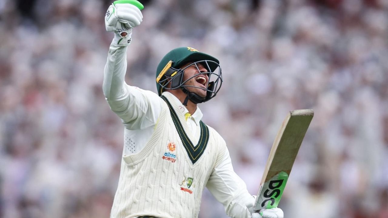 Australia’s Usman Khawaja celebrates reaching his century (100 runs) during day two of the third cricket Test match between Australia and South Africa. Credit: AFP Photo