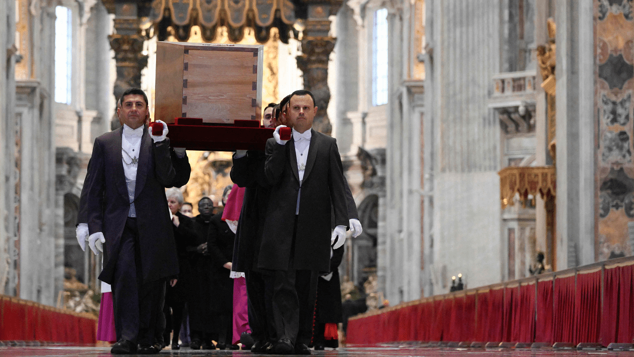 Pallbearers carry the coffin of Pope Emeritus Benedict XVI inside the St Peter's basilica during the funeral mass at St Peter's square in the Vatican. Credit: AFP Photo