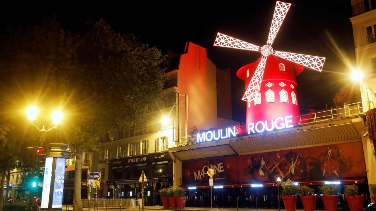 A view shows empty streets around the Moulin Rouge cabaret during the late-night curfew in Paris. Credit: Reuters file photo