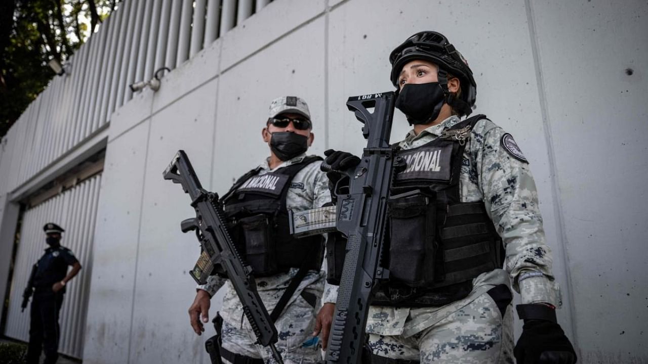 Members of the Mexican National Guard guard outside the Attorney General's Office for Special Investigations on Organized Crime (FEMDO) in Mexico City, on January 5, 2023, after the arrest of Ovidio Guzman, son of imprisoned drug trafficker Joaquin "El Chapo" Guzman.  Credit: AFP Photo