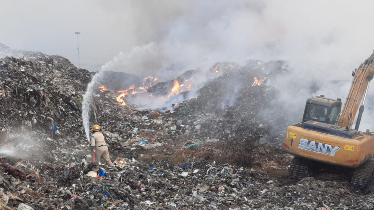 Fire personnel dousing the fire at landfill site in Pacchanady. Photo: Special arrangement 