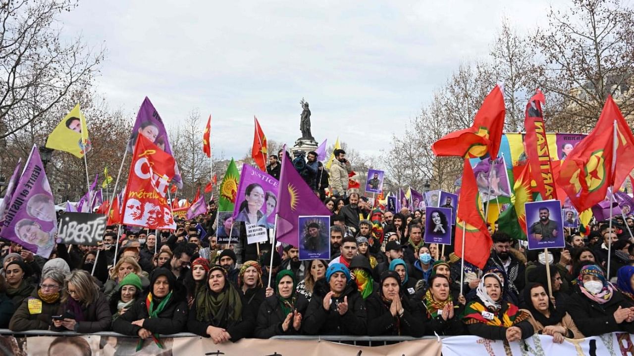 Demonstrators gather on Place de la Republique during a tribute march in the memory of the three Kurdish activists who were murdered in January 2013, in Paris. Credit: AFP Photo