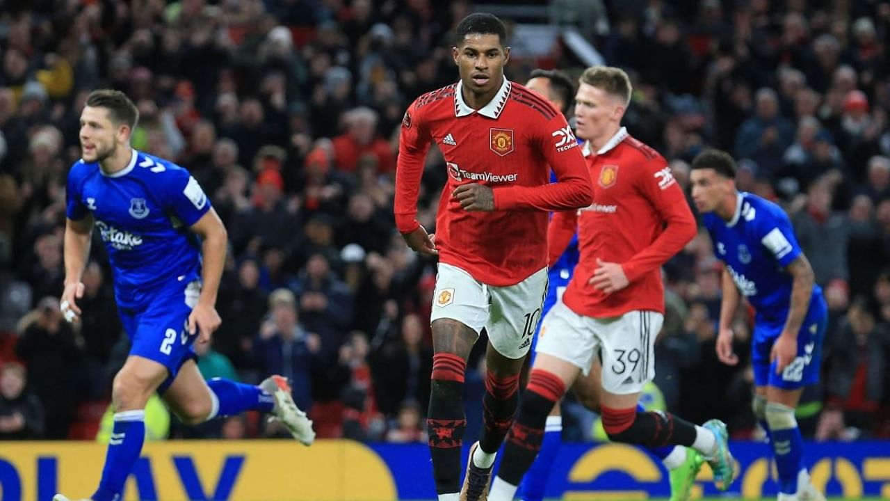 Manchester United's English striker Marcus Rashford (C) celebrates after scoring their third goal from the penalty spot. Credit: AFP Photo
