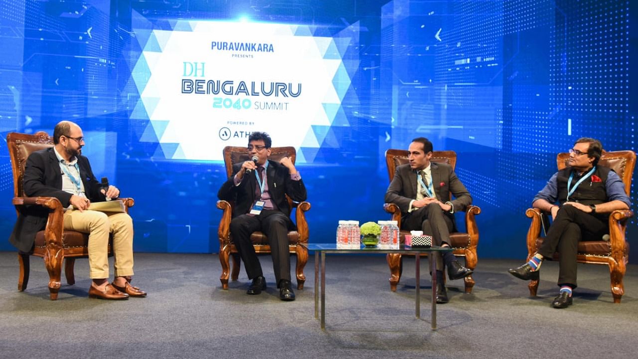 Abhishek Kapoor, Executive Director & CEO, Puravankara Ltd (extreme left) moderates a session on Redefining Bengaluru's public spaces as Tushar Girinath, Chief Commissioner, BBMP speaks along with Ashish Puravankara, MD Puravankara Ltd and NSN Murty, Partner & Leader, Government & Public Services, Deloitte Consulting at the Deccan Herald 2040 Summit on Saturday. Credit: DH Photo