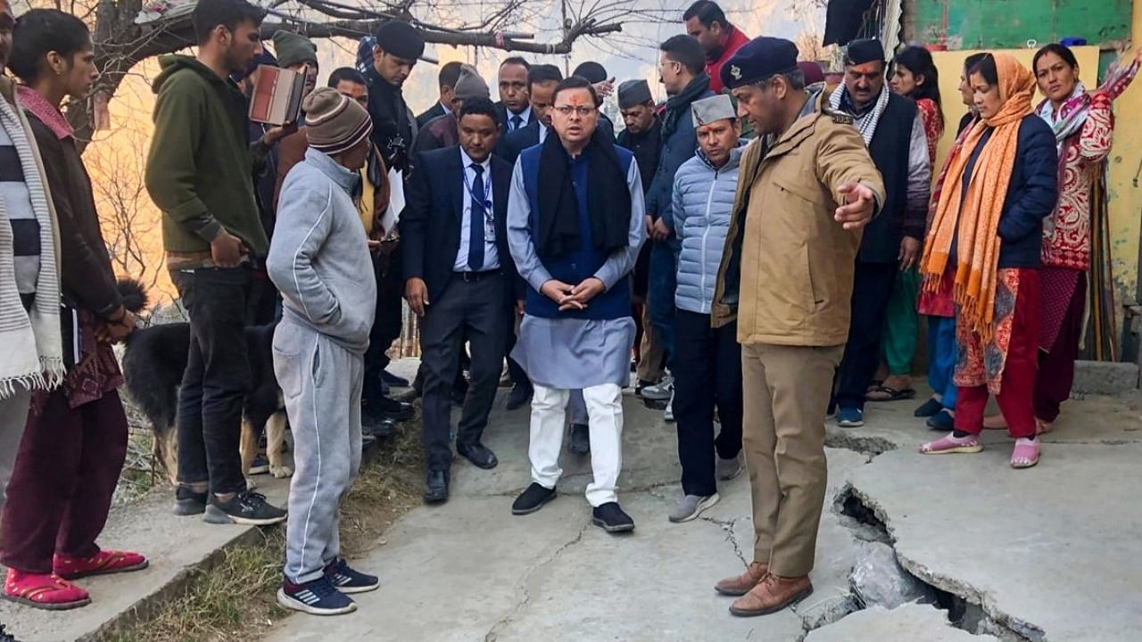 Uttarakhand CM Pushkar Singh Dhami inspects the landslide affected area of Joshimath. Credit: PTI 