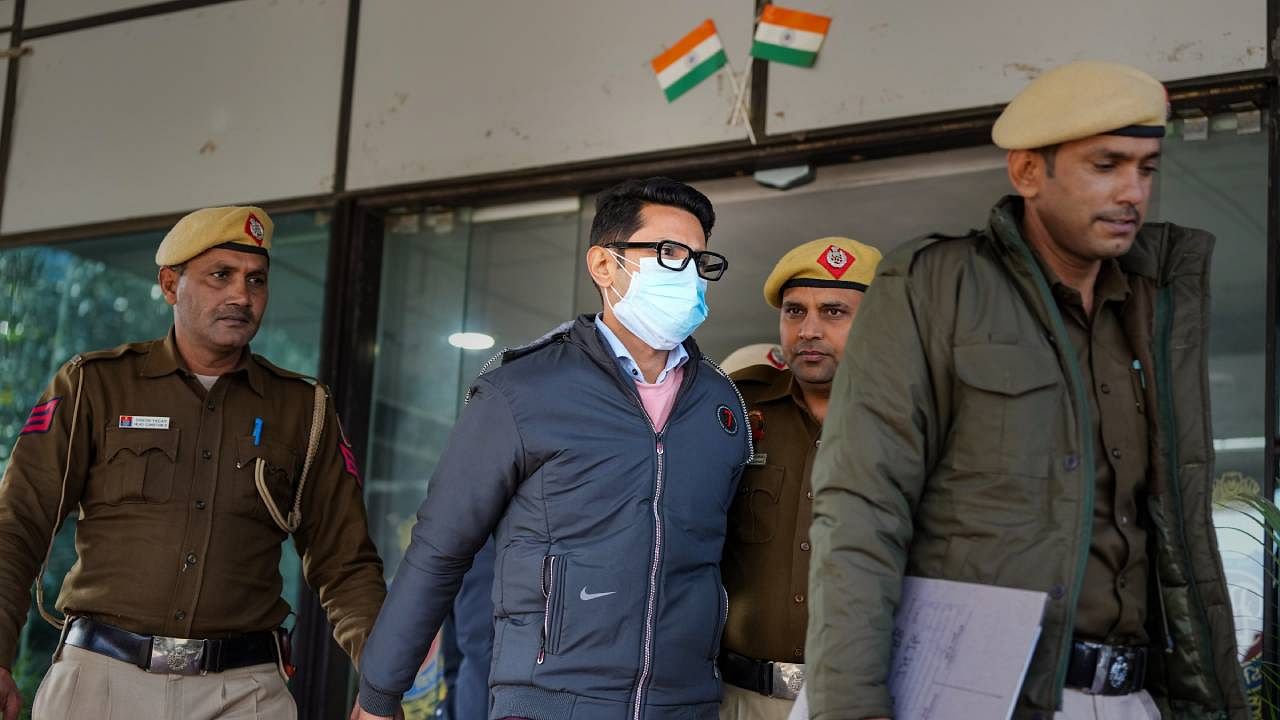 Shankar Mishra, accused of urinating on a woman passesnger on an Air India flight from New York to Delhi, being taken away by the police from the DCP office at IGI Airport in New Delhi. Credit: PTI Photo