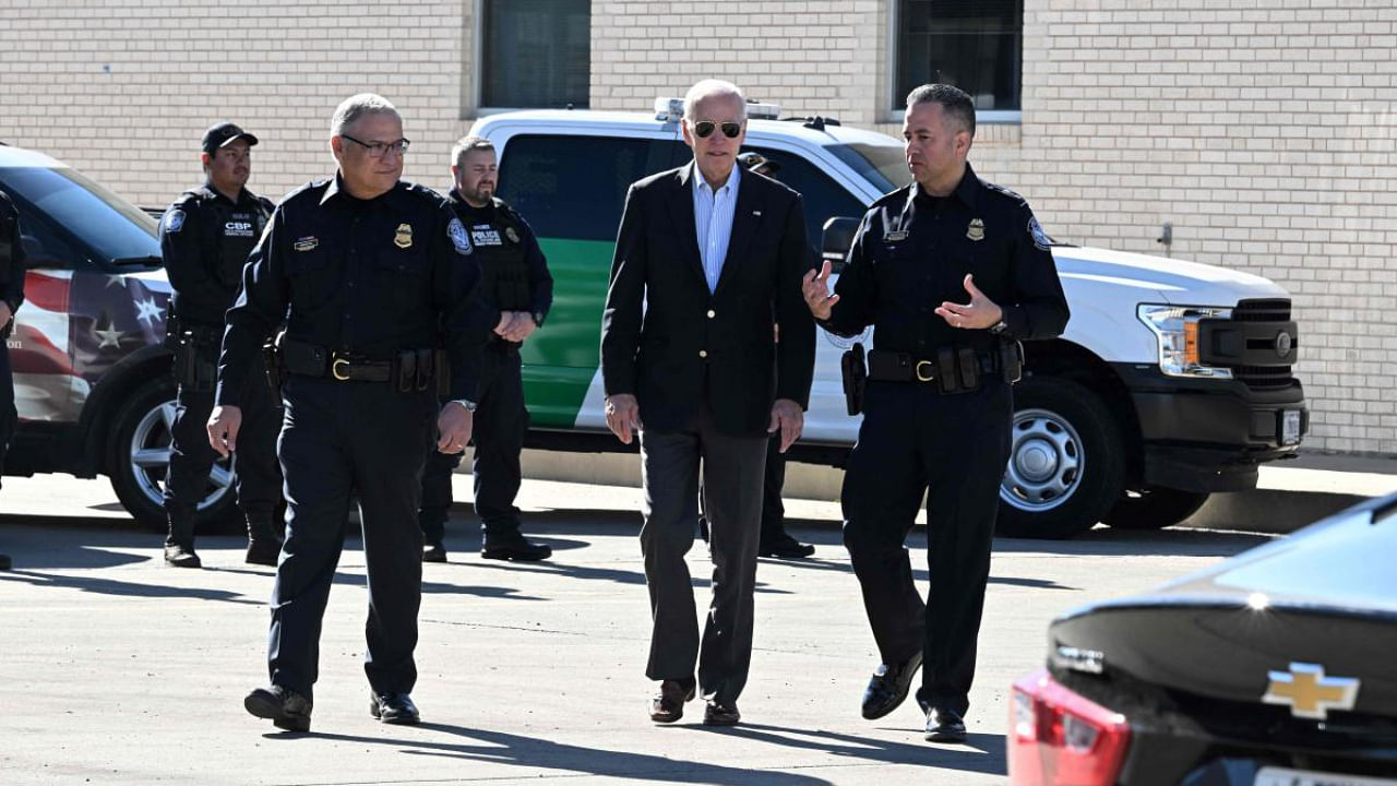 US President Joe Biden speaks with US Customs and Border Protection police on the Bridge of the Americas border crossing between Mexico and the US in El Paso, Texas. Credit: AFP Photo