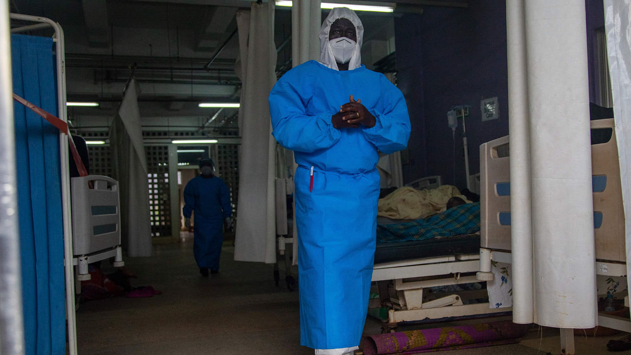 In this file photo taken on September 24, 2022 a member of the Ugandan Medical staff of the Ebola Treatment Unit stands inside the ward in Personal Protective Equipment (PPE) at Mubende Regional Referral Hospital in Uganda. Credit: AFP Photo