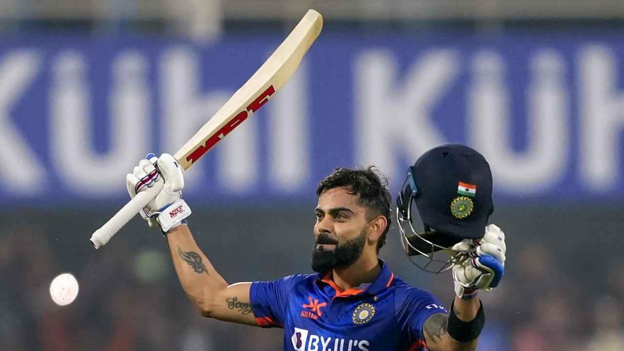 Indian batter Virat Kohli celebrates his century during the 1st ODI cricket match between India and Sri Lanka, at Barsapara stadium in Guwahati. Credit: PTI