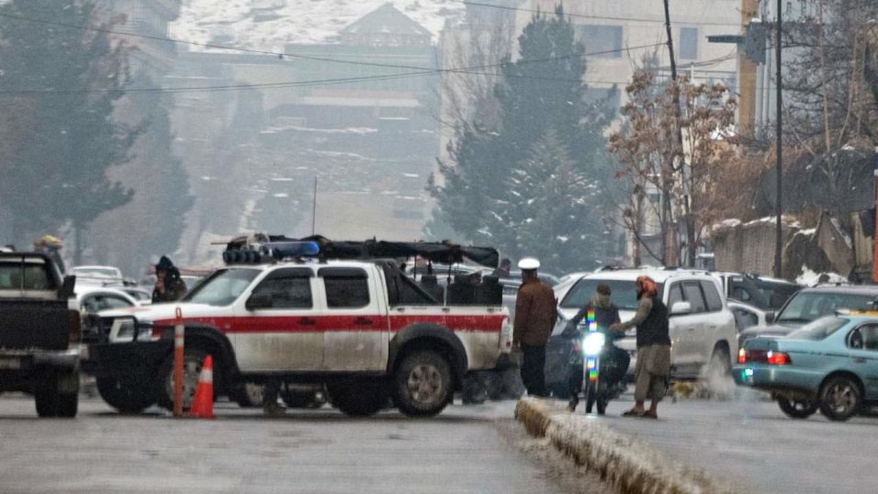 Taliban security forces block a road after a suicide blast near Afghanistan's foreign ministry at the Zanbaq Square in Kabul on January 11, 2023. Credit: AFP Photo