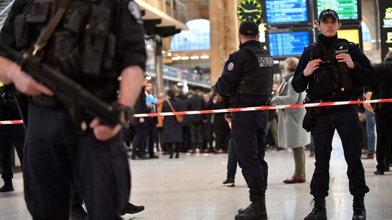French police stand guard in a cordonned off area at Paris' Gare du Nord train station. Credit: AFP Photo